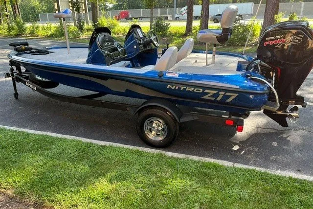 Slide: The Image of 2026 Nitro Z17 boat with Mercury Pro XS engine, parked on a sunny day. - 1