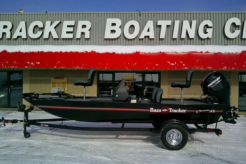 Slide: The Image of 2026 Tracker Bass Tracker Classic XL boat outside Tracker Boating Center in snowy setting. - 61