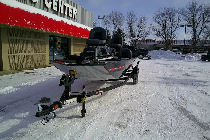 Slide: The Image of 2026 Tracker Bass Tracker Classic XL boat on trailer in snowy parking lot. - 62