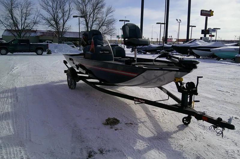 Slide: The Image of 2026 Tracker Bass Tracker Classic XL boat on snowy dealership lot. - 63