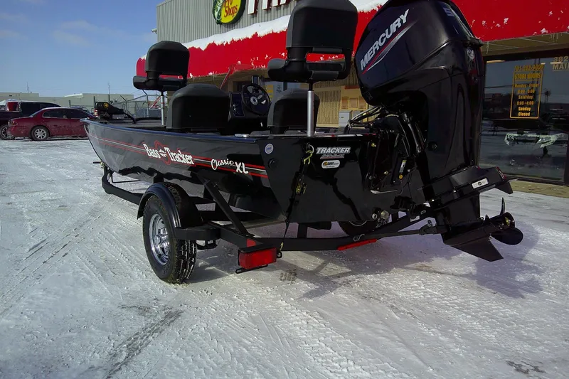 Slide: The Image of 2026 Tracker Bass Tracker Classic XL boat on snowy ground, rear view. - 64
