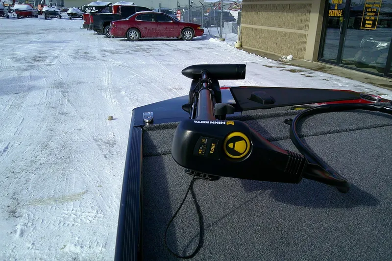 Slide: The Image of 2026 Tracker Bass Tracker Classic XL with Minn Kota motor in snowy parking lot. - 66