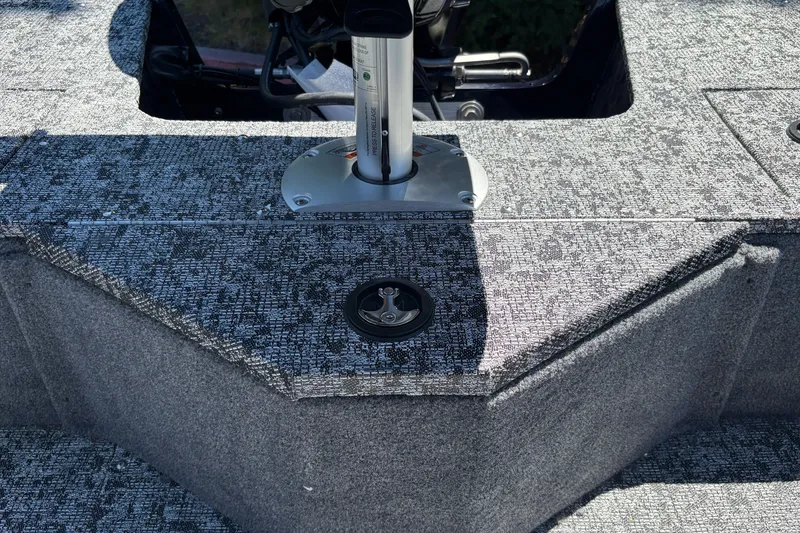 Slide: The Image of 2026 Tracker Pro Guide V-16 SC boat interior with textured flooring and seat mount. - 33