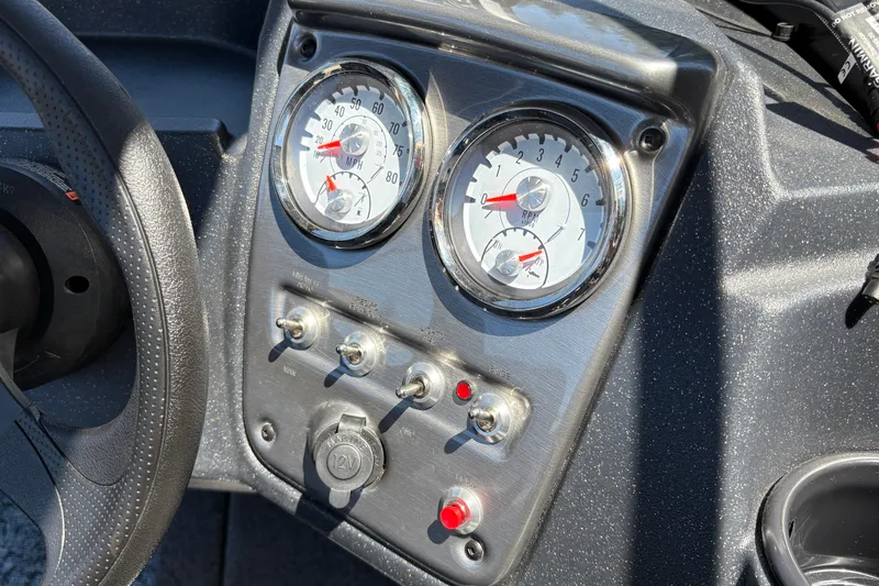 Slide: The Image of Dashboard of 2026 Tracker Pro Guide V-16 SC boat with gauges and switches. - 19