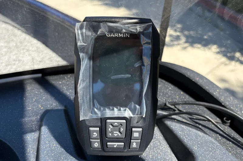 Slide: The Image of Garmin device on 2026 Tracker Pro Guide V-16 SC boat dashboard, wrapped in protective film. - 20