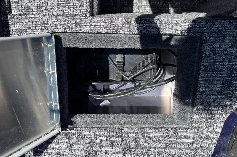 Slide: The Image of Open storage compartment in 2026 Tracker Pro Guide V-16 SC boat. - 32