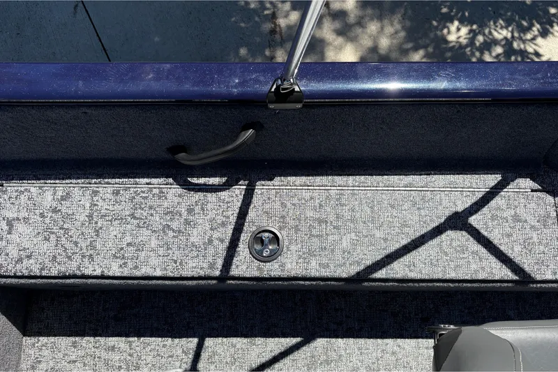 Slide: The Image of 2026 Tracker Pro Guide V-16 SC boat interior with textured flooring and handle. - 31