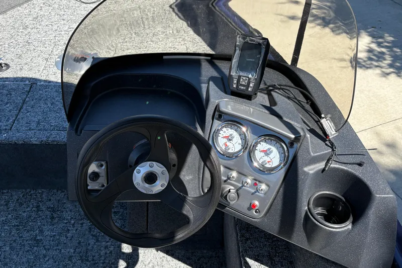 Slide: The Image of Steering console of 2026 Tracker Pro Guide V-16 SC boat with gauges and electronics. - 18