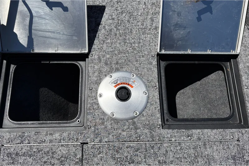 Slide: The Image of 2026 Tracker Pro Guide V-16 SC boat deck with storage compartments and seat base. - 40