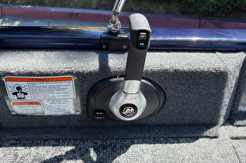 Slide: The Image of Throttle control and warning labels on 2026 Tracker Pro Guide V-16 SC boat. - 29