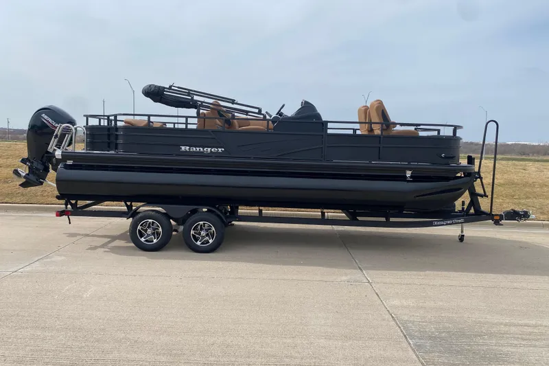 The Image of 2026 Ranger 220F pontoon boat on trailer, featuring sleek black design and Mercury outboard motor. - 56