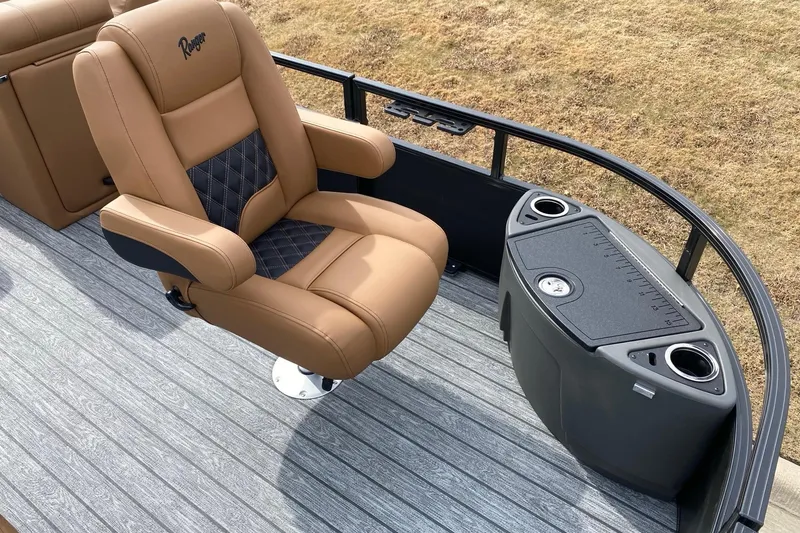Slide: The Image of Luxurious tan seat on 2026 Ranger 220F boat with cup holders and storage. - 60