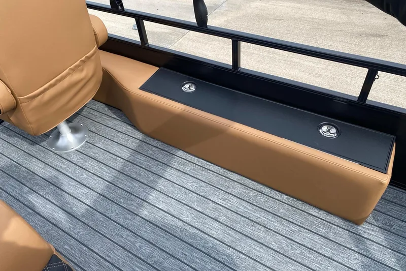 Slide: The Image of 2026 Ranger 220F boat interior with tan seating and gray flooring. - 67