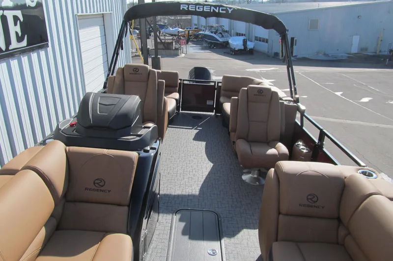 Slide: The Image of 2026 Regency 230 DL pontoon boat with luxurious seating and modern design. - 11