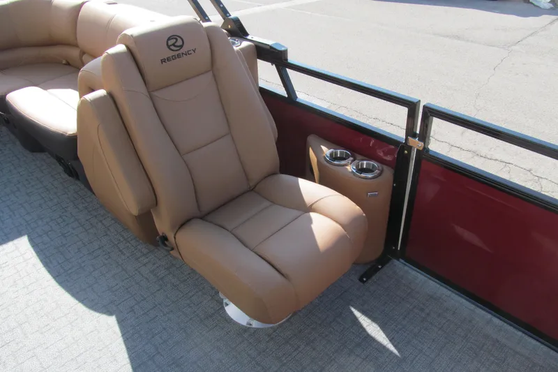 Slide: The Image of Luxurious seating on 2026 Regency 230 DL boat with cup holders and plush upholstery. - 13
