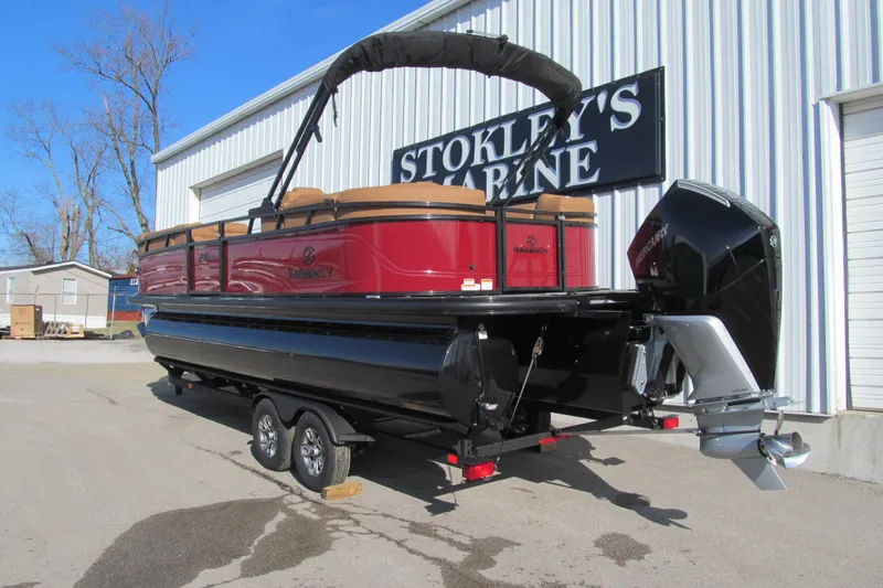 Slide: The Image of 2026 Regency 230 DL pontoon boat on trailer at Stokley's Marine dealership. - 4
