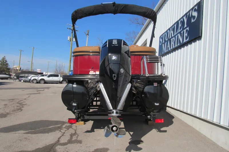Slide: The Image of 2026 Regency 230 DL boat at Stokley's Marine, rear view with outboard motor. - 5