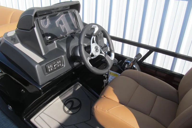 Slide: The Image of 2026 Regency 230 DL boat cockpit with steering wheel and control panel. - 8