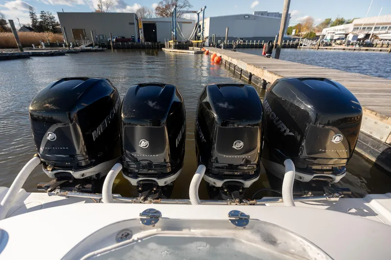 Slide: The Image of Four Mercury outboard engines on a 2018 Yellowfin 39 Offshore boat at a dock. - 11