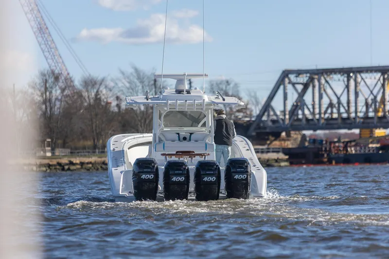 Slide: The Image of 2018 Yellowfin 39 Offshore boat with quad 400 engines on a river. - 17