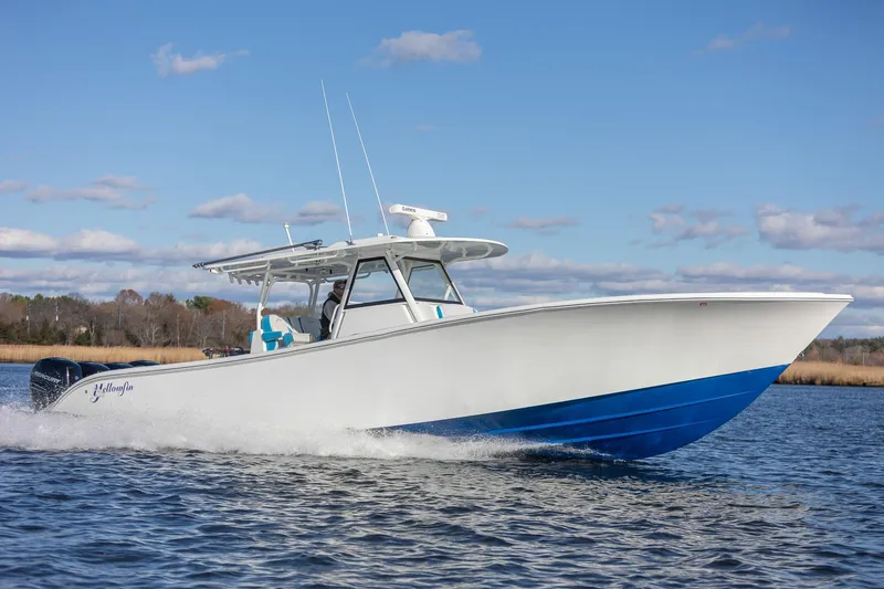 Slide: The Image of 2018 Yellowfin 39 Offshore boat cruising on water under clear blue sky. - 3