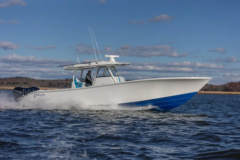 Slide: The Image of 2018 Yellowfin 39 Offshore boat cruising on open water under a clear sky. - 33