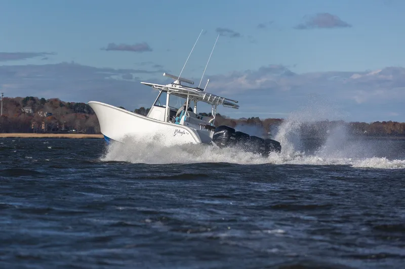 Slide: The Image of 2018 Yellowfin 39 Offshore boat cruising on open water with powerful engines. - 41