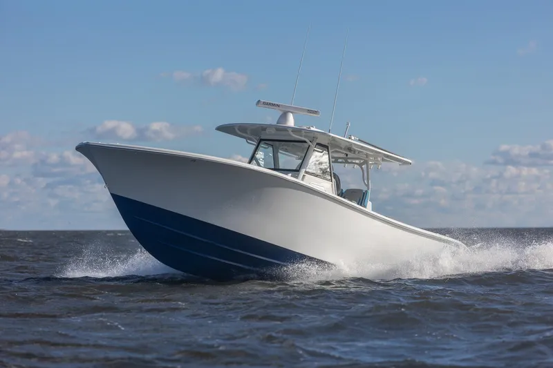 Slide: The Image of 2018 Yellowfin 39 Offshore boat cruising on open water under clear skies. - 43