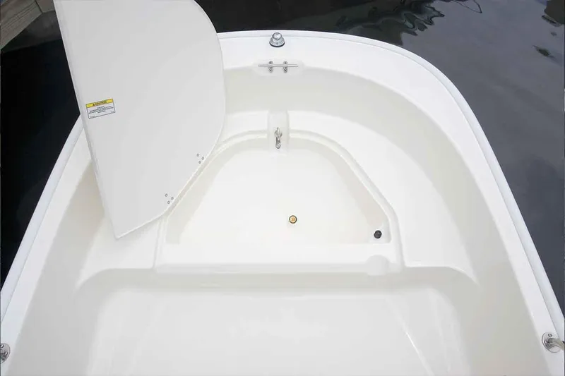 Slide: The Image of Manufacturer Provided Image: 2020 Boston Whaler 110 Sport boat interior with open storage compartment. - 14