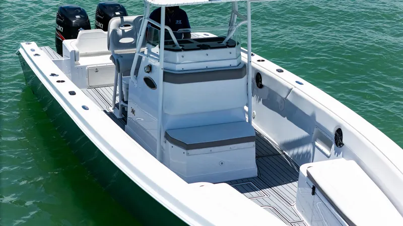 Slide: The Image of 1999 Monza 31 boat on water, featuring dual Suzuki outboard engines. - 15