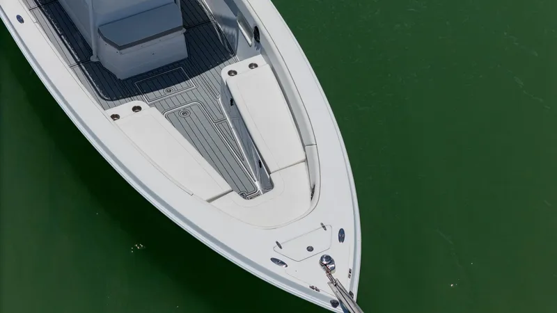 Slide: The Image of Aerial view of 1999 Monza 31 boat on green water. - 16