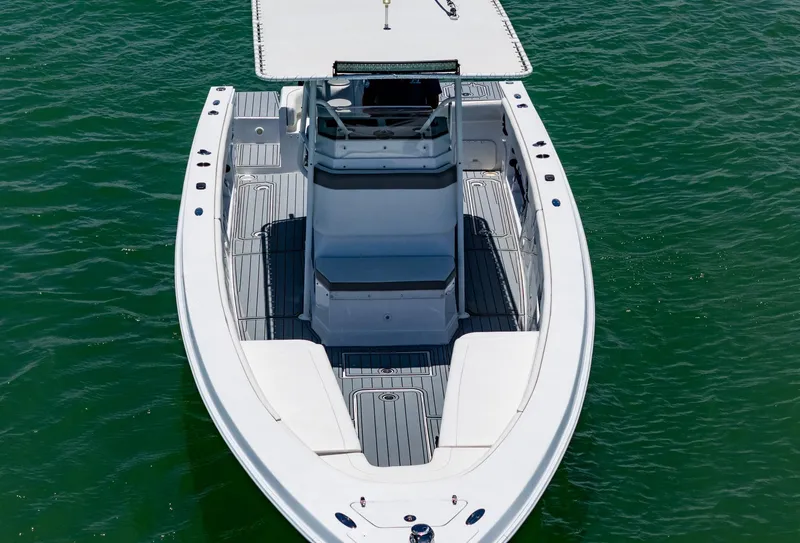 Slide: The Image of Aerial view of a 1999 Monza 31 boat on green water. - 19