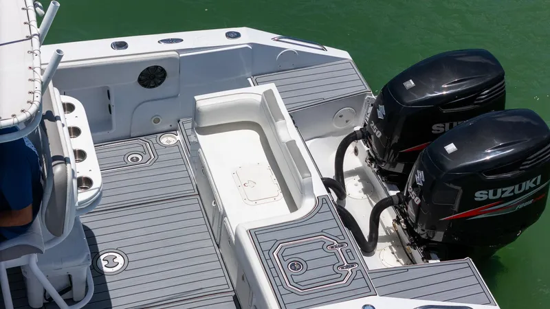 Slide: The Image of 1999 Monza 31 boat with dual Suzuki 250 outboard engines on a sleek deck. - 20