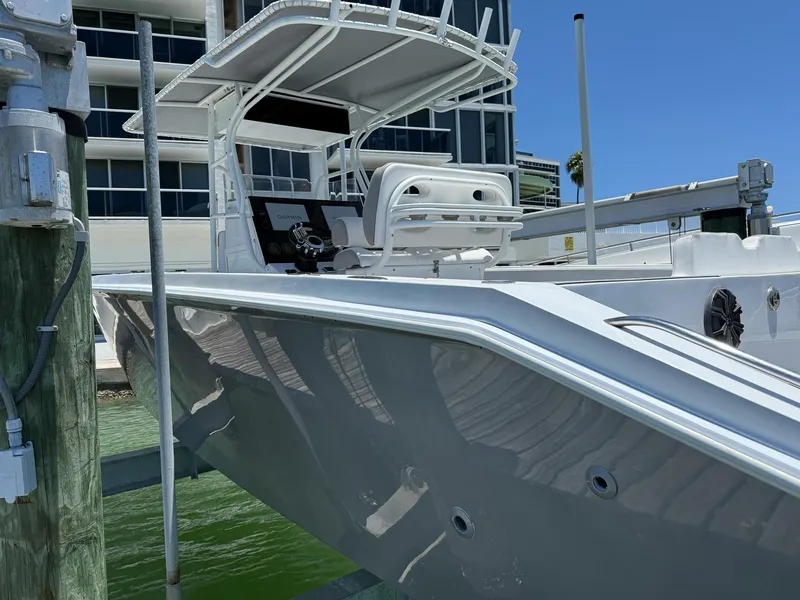 Slide: The Image of A 1999 Monza 31 boat docked, featuring sleek design and modern equipment. - 28