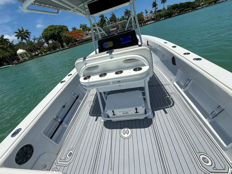Slide: The Image of 1999 Monza 31 boat interior with seating, cup holders, and scenic waterfront view. - 43