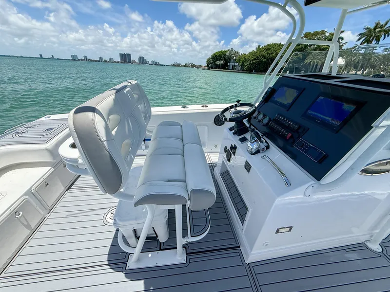 Slide: The Image of 1999 Monza 31 boat interior with helm, dual seats, and ocean view. - 45