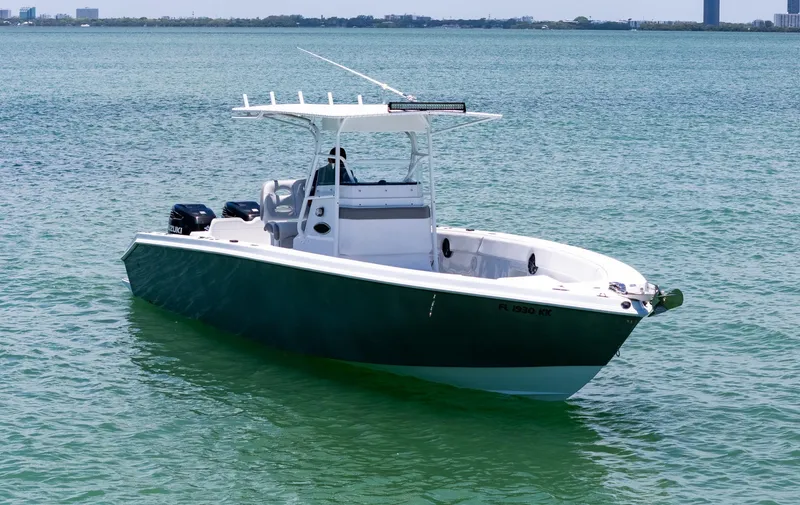 Slide: The Image of Front view of a 1999 Monza 31 boat on calm water. - 8