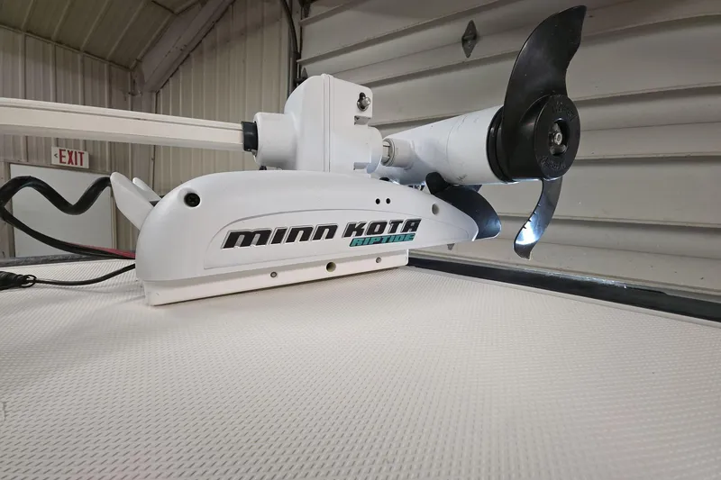 Slide: The Image of Minn Kota Riptide motor on 2011 Boston Whaler 190 Montauk boat in garage. - 14
