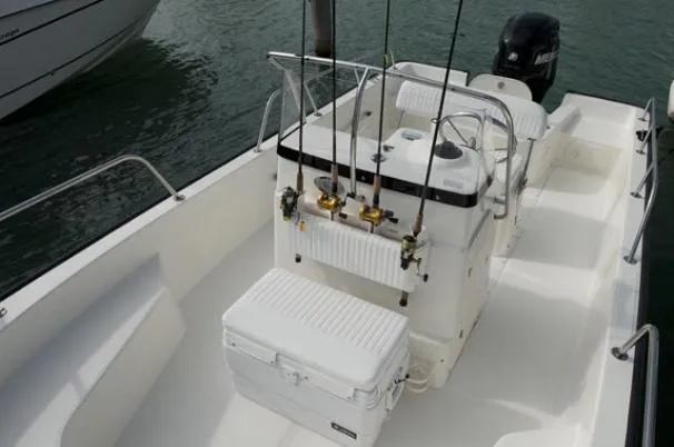 Slide: The Image of 2011 Boston Whaler 190 Montauk boat on trailer in garage setting. - 2