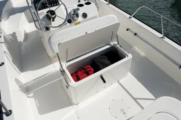 Slide: The Image of 2011 Boston Whaler 190 Montauk boat interior in a workshop setting. - 4