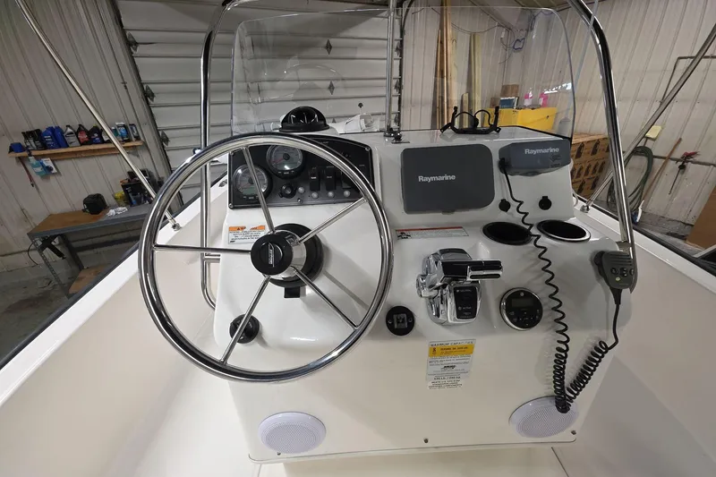 Slide: The Image of 2011 Boston Whaler 190 Montauk boat console with steering wheel and Raymarine electronics. - 8