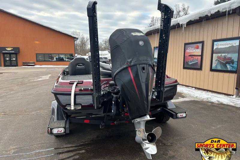 Slide: The Image of 2025 Nitro Z21 XL boat at D&R Sports Center, rear view with motor and snow. - 3