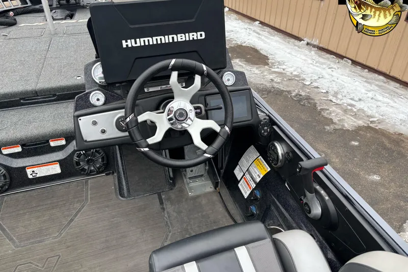 Slide: The Image of 2025 Nitro Z21 XL boat cockpit with Humminbird electronics and modern steering wheel. - 6