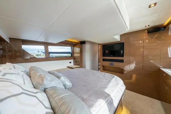 Slide: The Image of Luxurious bedroom interior of 2018 Cruisers Yachts 50 Cantius with modern design and large windows. - 26