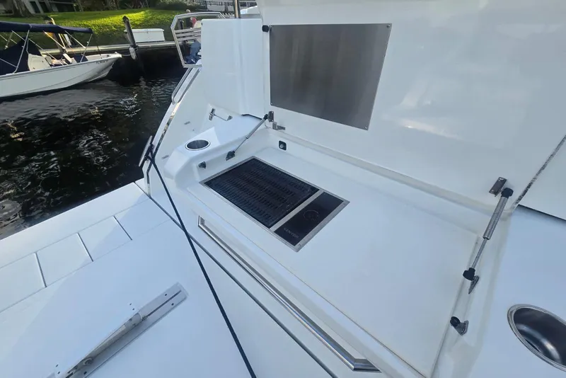 Slide: The Image of Engine room of 2018 Cruisers Yachts 50 Cantius, featuring mechanical components and piping. - 34