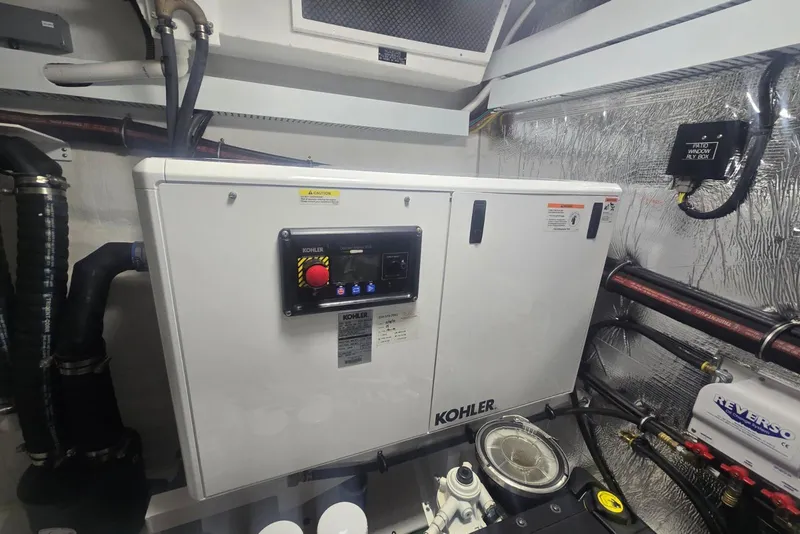 Slide: The Image of Engine room of 2018 Cruisers Yachts 50 Cantius with visible pipes and equipment. - 44