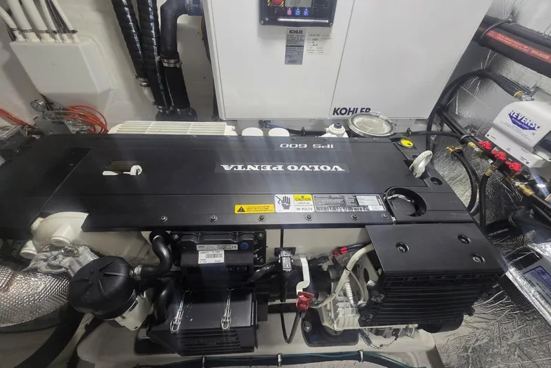 Slide: The Image of Engine room of 2018 Cruisers Yachts 50 Cantius with fuel filters and control panel. - 45