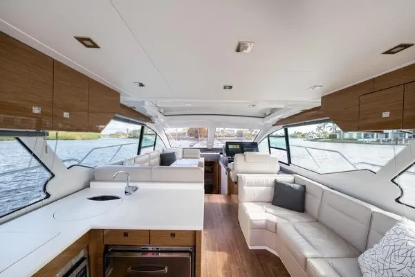 Slide: The Image of Luxurious interior of 2018 Cruisers Yachts 50 Cantius with modern furnishings and panoramic windows. - 15