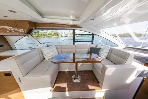 Slide: The Image of Luxurious interior of 2018 Cruisers Yachts 50 Cantius with elegant seating and scenic water view. - 16