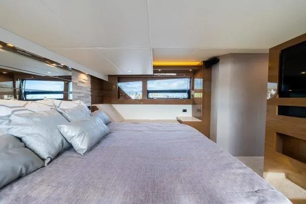 Slide: The Image of Luxurious bedroom interior of 2018 Cruisers Yachts 50 Cantius with modern design and large windows. - 18